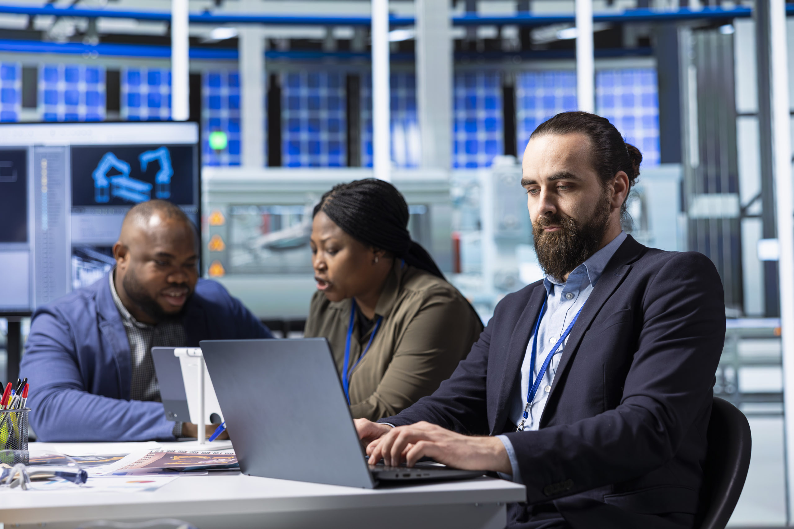 Production plant expert analyzing manufacturing research and development data